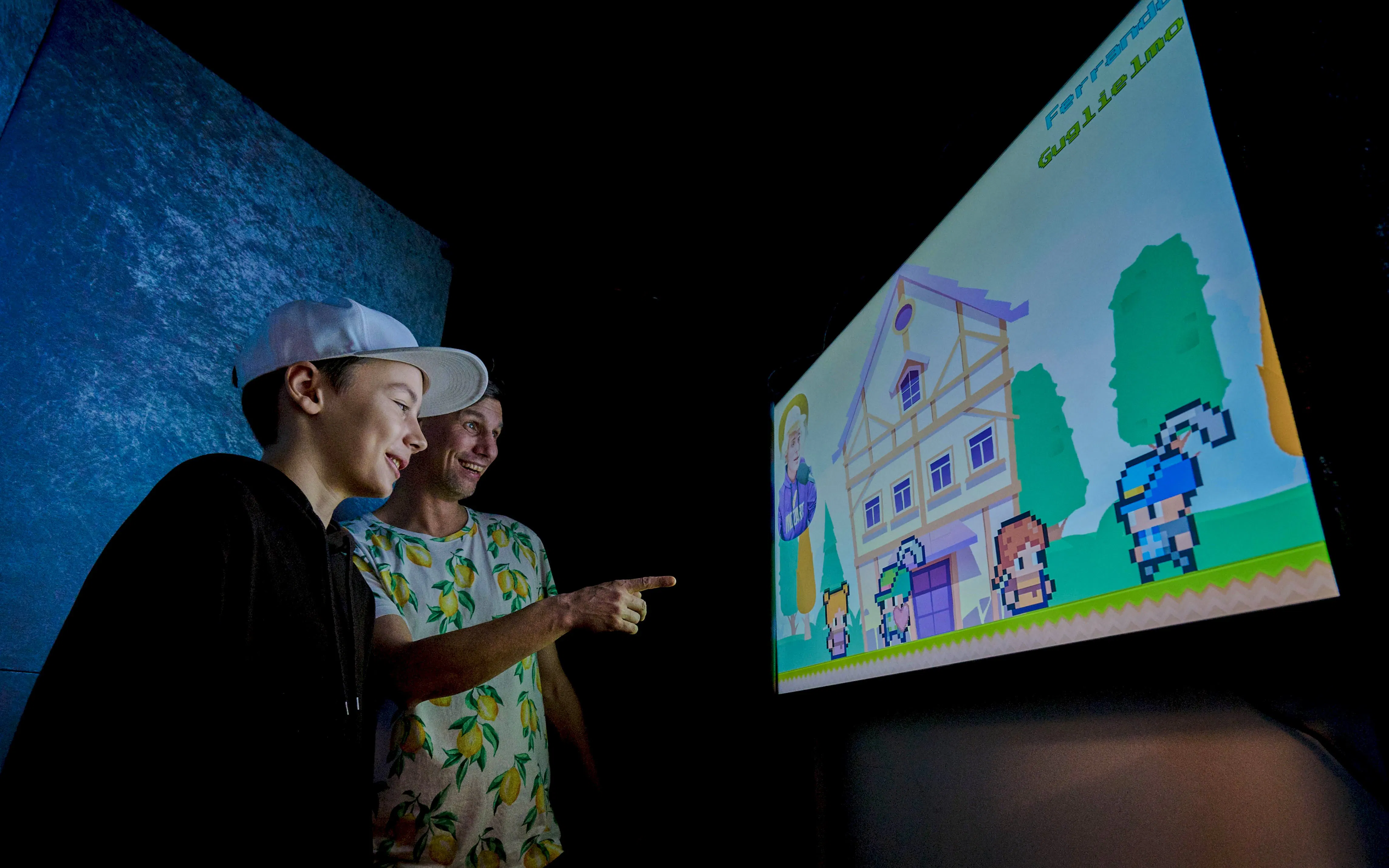 Guests interacting with digital exhibits at Mozart Interactive Museum in Prague.