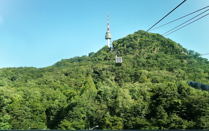 Cable car ascending with Namsan Tower in the background, Seoul, South Korea.