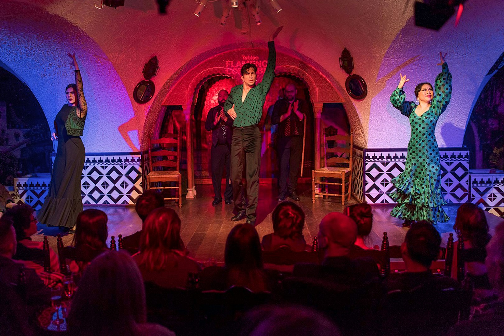 Tablao Cordobes Flamenco dancers performing on stage in a vibrant setting.
