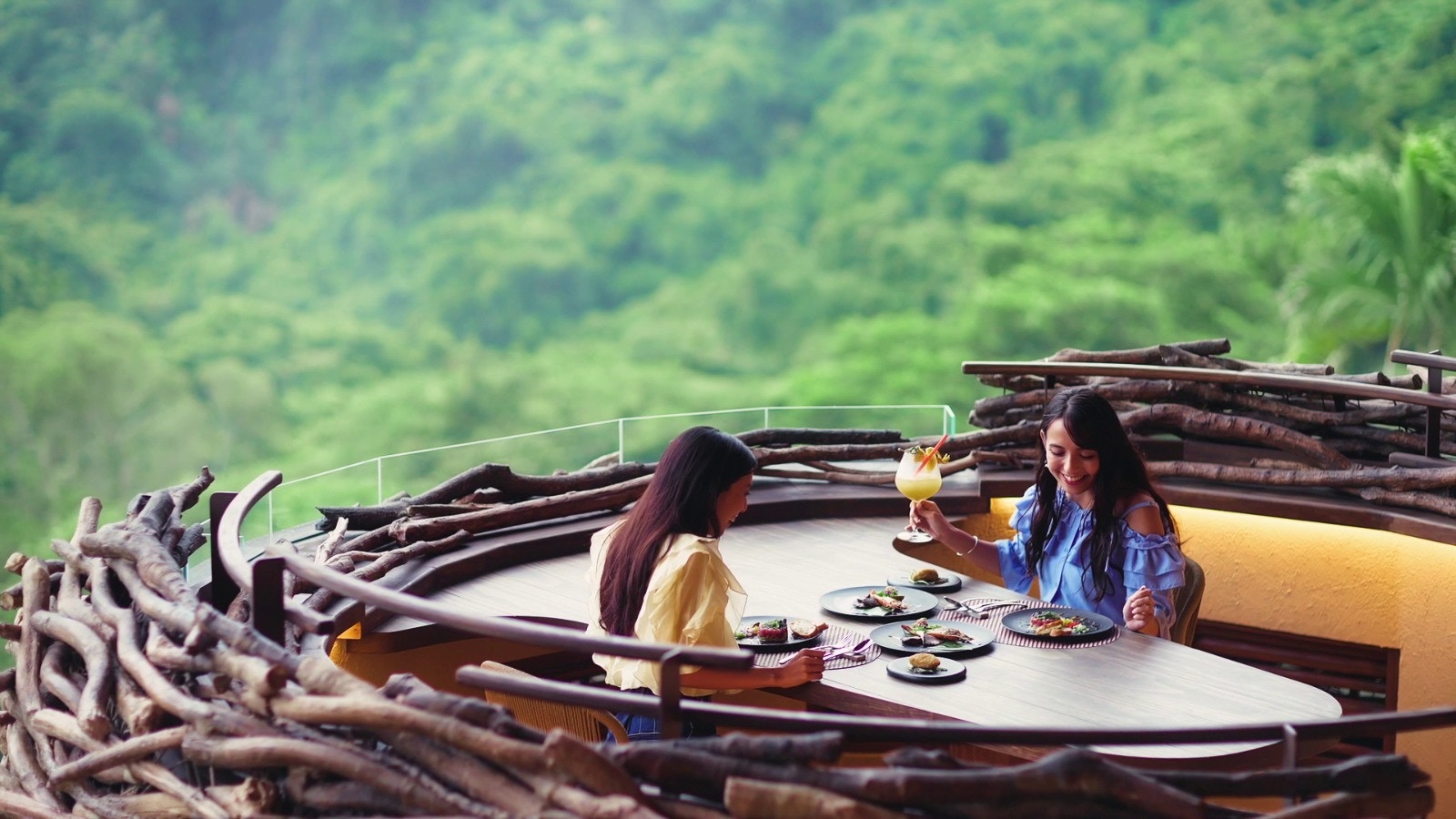 Dining with a view at JUNGLIA OKINAWA Park, surrounded by lush greenery.