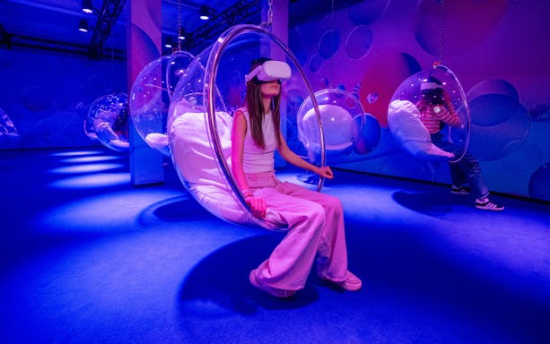 Visitors enjoying Bubble Planet VR experience in Singapore.