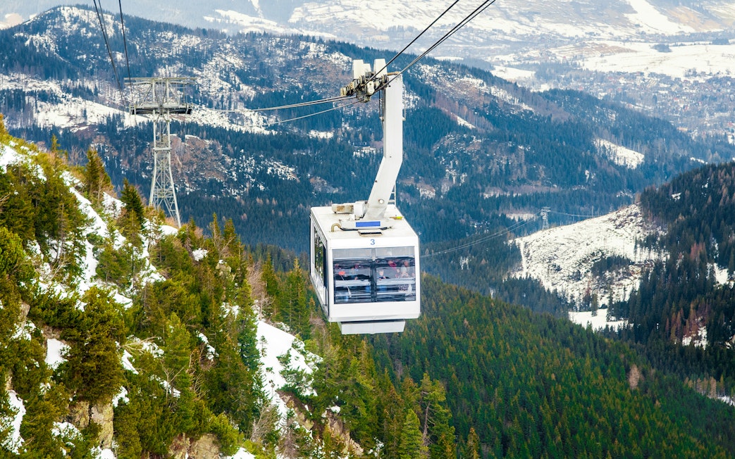 Cable car over snowy Tatra Mountains near Morskie Oko, Zakopane.