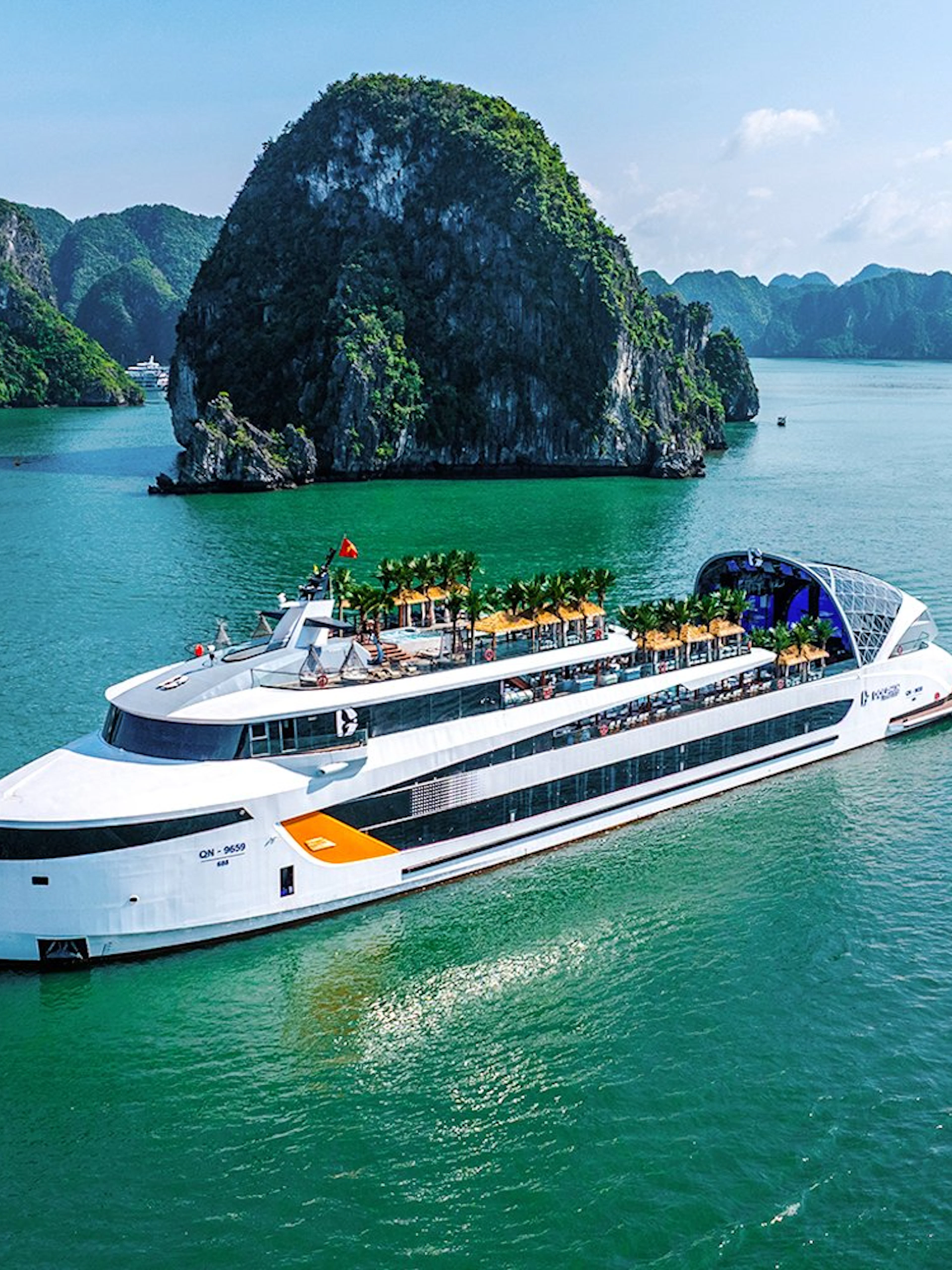 Aerial view of a cruise ship near limestone islands in Halong Bay, Vietnam.