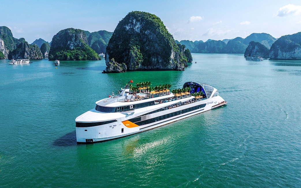 Aerial view of a cruise ship near limestone islands in Halong Bay, Vietnam.