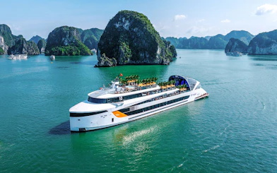 Aerial view of a cruise ship near limestone islands in Halong Bay, Vietnam.