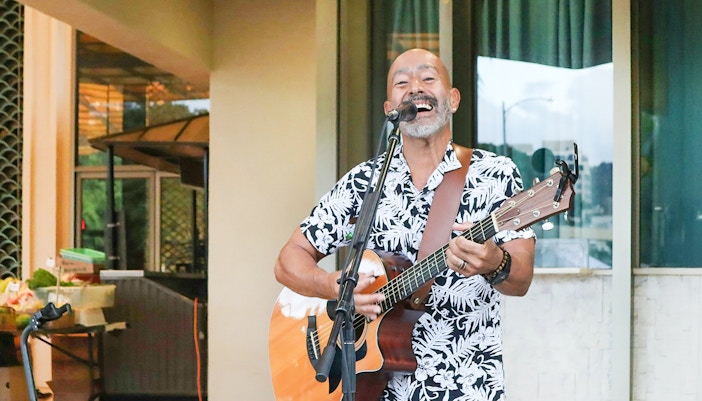 Man playing Slack-key guitar in Hawaii.