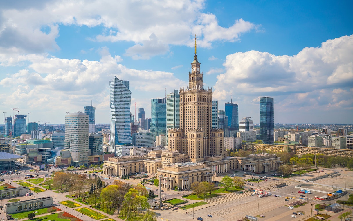 Palace of Culture and Science in Warsaw with surrounding skyscrapers.