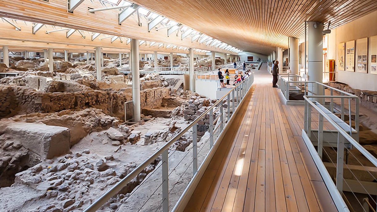 Guests exploring the Akrotiri Excavations site in Santorini, Greece.