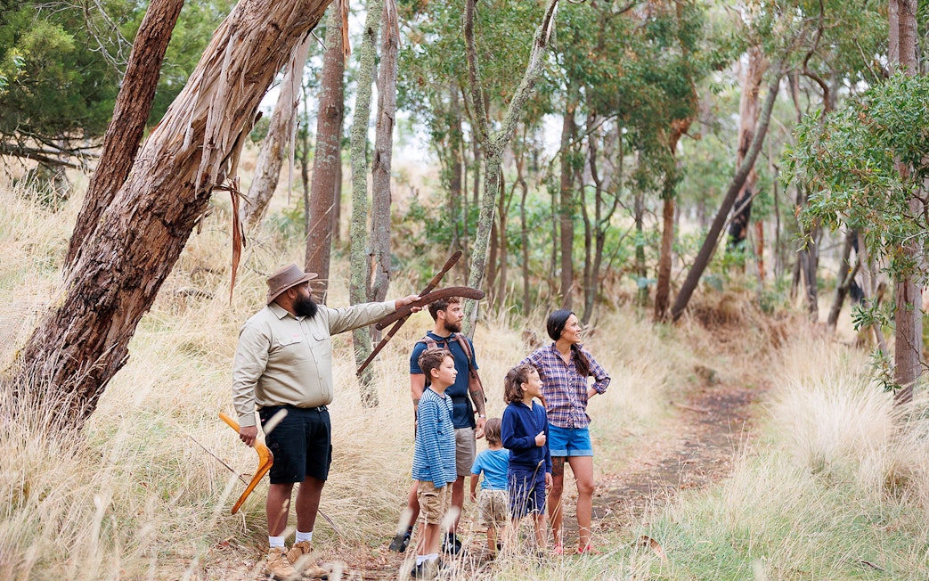 Guide leading a group through Tungatt Mirring forest on Stone Country Half Day Tour.