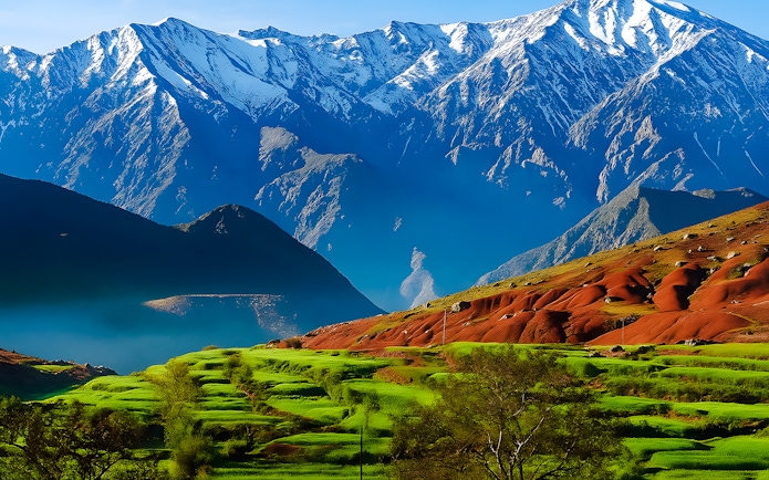 Terraced fields with Atlas Mountains in Agafay Desert, Marrakech.