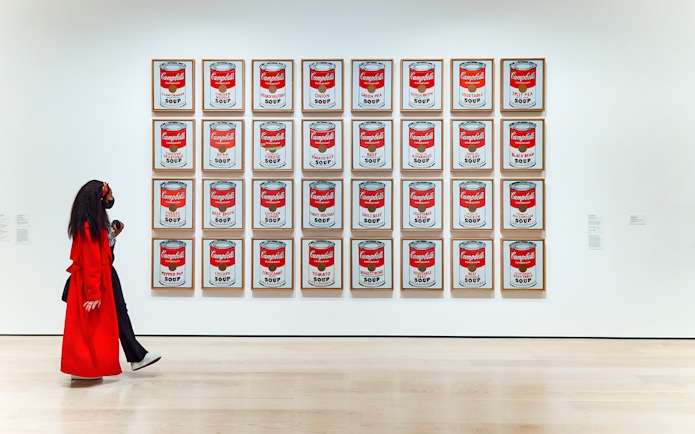 Visitors viewing Warhol's Campbell's Soup Cans at the Combo Save 27% tour exhibit.