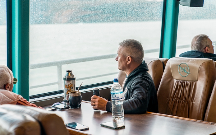 Tourist inside boat viewing Perito Moreno, Spegazzini, and Upsala glaciers.
