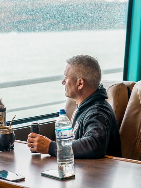 Tourist inside boat viewing Perito Moreno, Spegazzini, and Upsala glaciers.