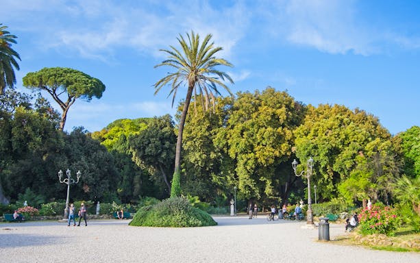 Villa Borghese park with people walking and cycling, Rome golf cart tour.