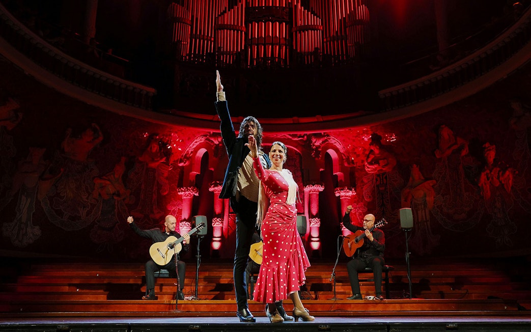 Flamenco dancers and guitarists performing at Palau de la Música, Barcelona.