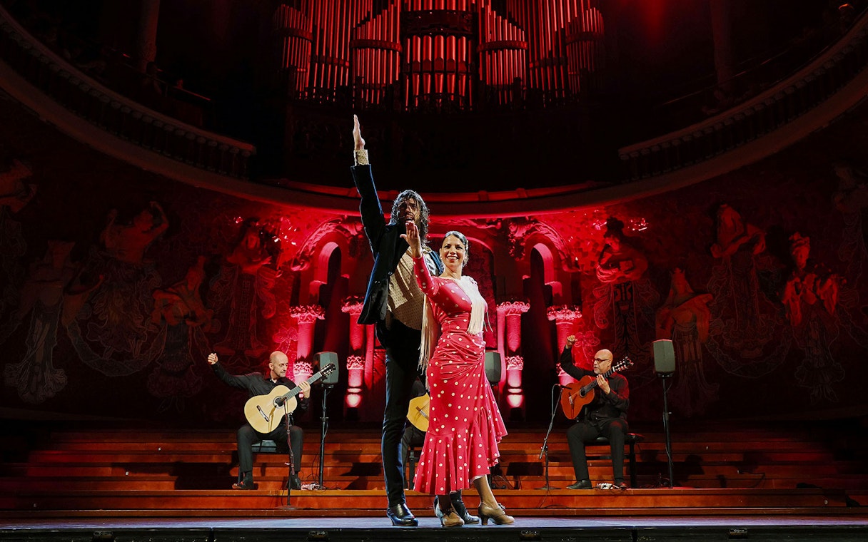Flamenco dancers and guitarists performing at Palau de la Música, Barcelona.