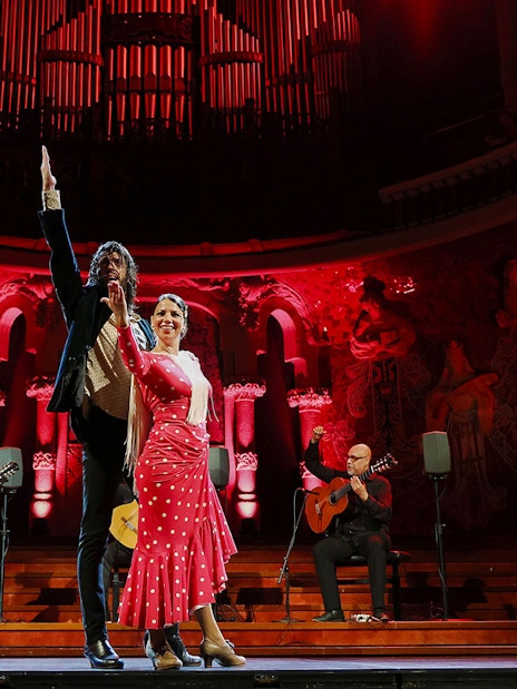 Flamenco dancers and guitarists performing at Palau de la Música, Barcelona.