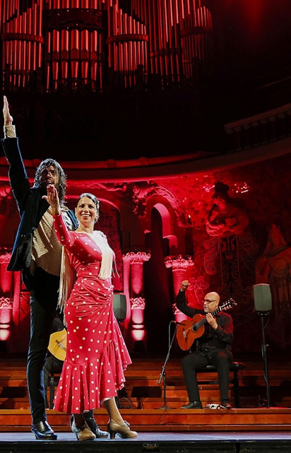 Flamenco dancers and guitarists performing at Palau de la Música, Barcelona.