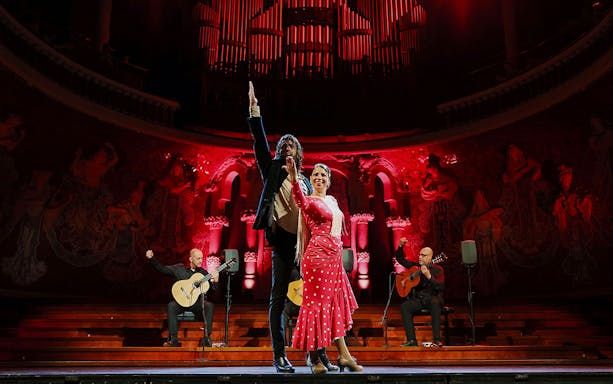 Flamenco dancers and guitarists performing at Palau de la Música, Barcelona.