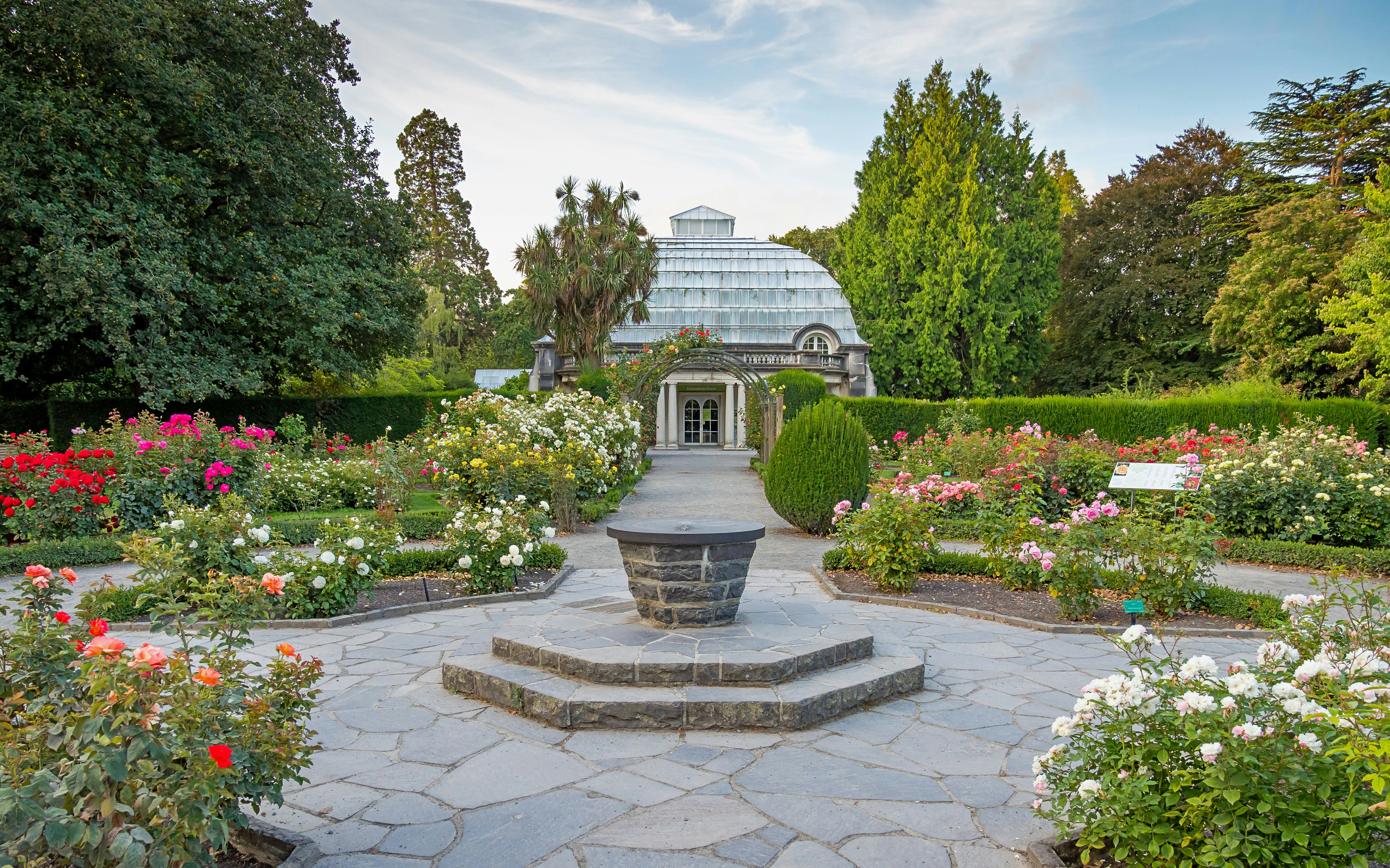 Rose garden with Cuningham House at Botanic Gardens Conservatory, Christchurch.