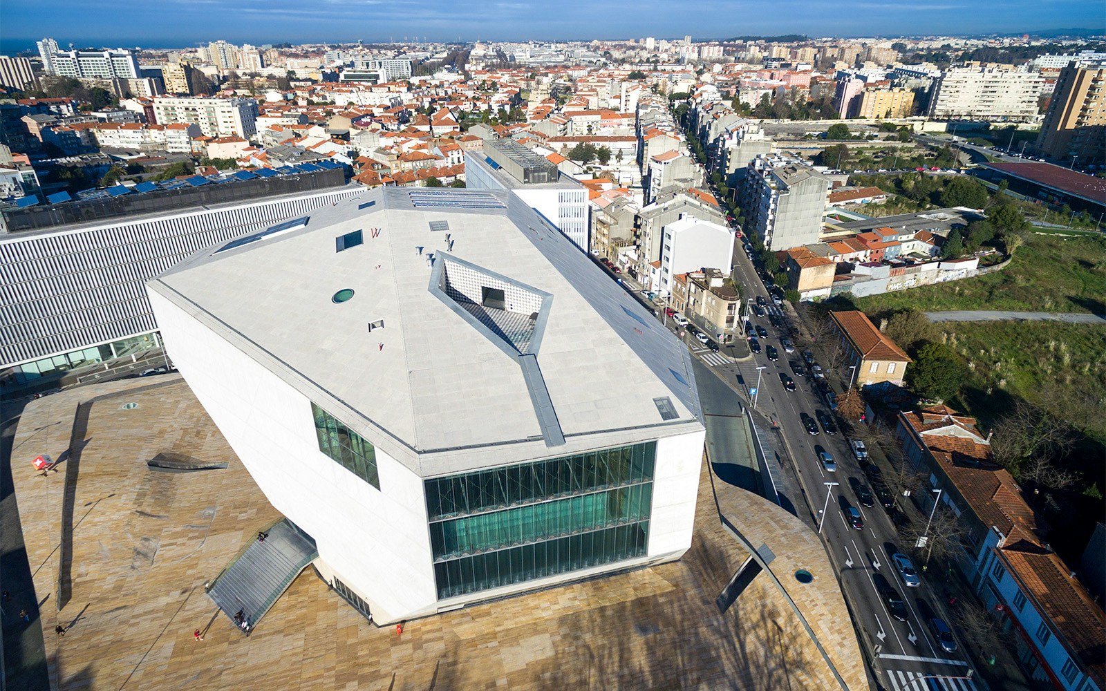 Tourists exploring the House of Music in Porto, a unique architectural landmark and concert venue