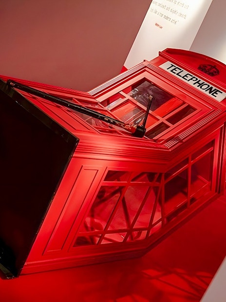 Red telephone booth installation at Banksy Limitless Exhibition.