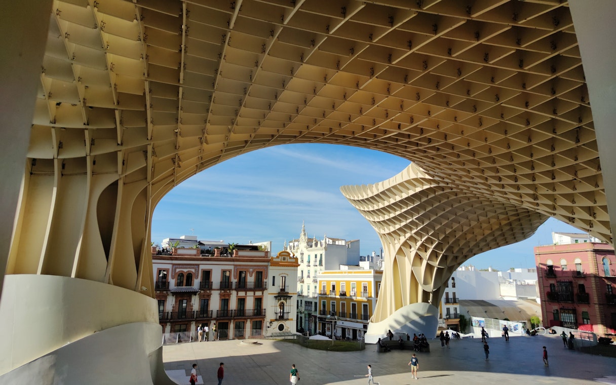 Visitors exploring Setas de Sevilla structure in Seville, Spain.