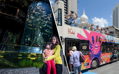 KL Hop-on Hop-off bus with tourists and Aquaria KLCC aquarium with visitors.