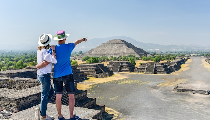 Tourists exploring Pyramid of the Sun at Teotihuacan, Mexico.