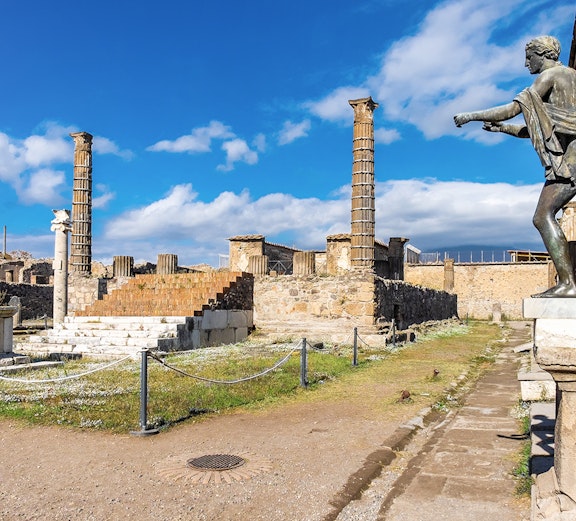 Pompeii ruins with Mount Vesuvius in the background on Rome to Amalfi Coast day trip.