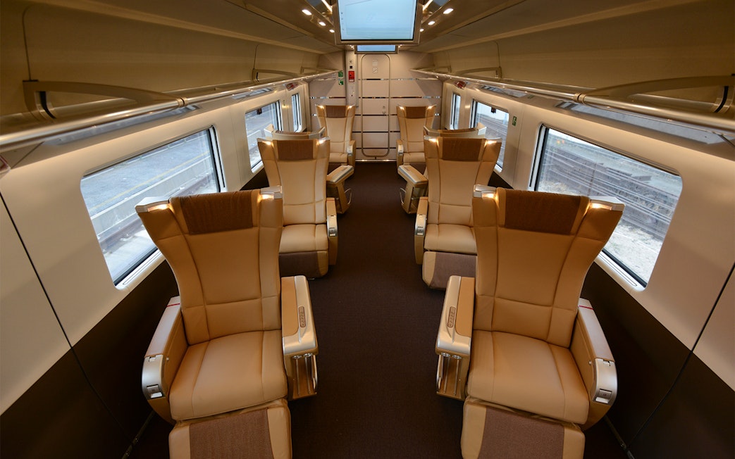 Luxurious train interior with spacious seating, part of the Interrail Global Mobile Pass experience.