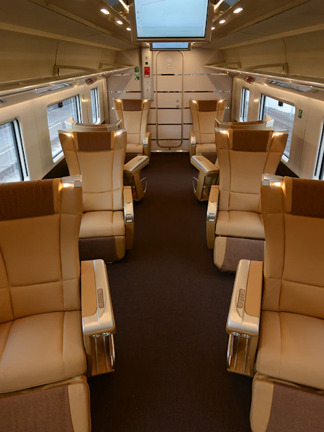 Luxurious train interior with spacious seating, part of the Interrail Global Mobile Pass experience.