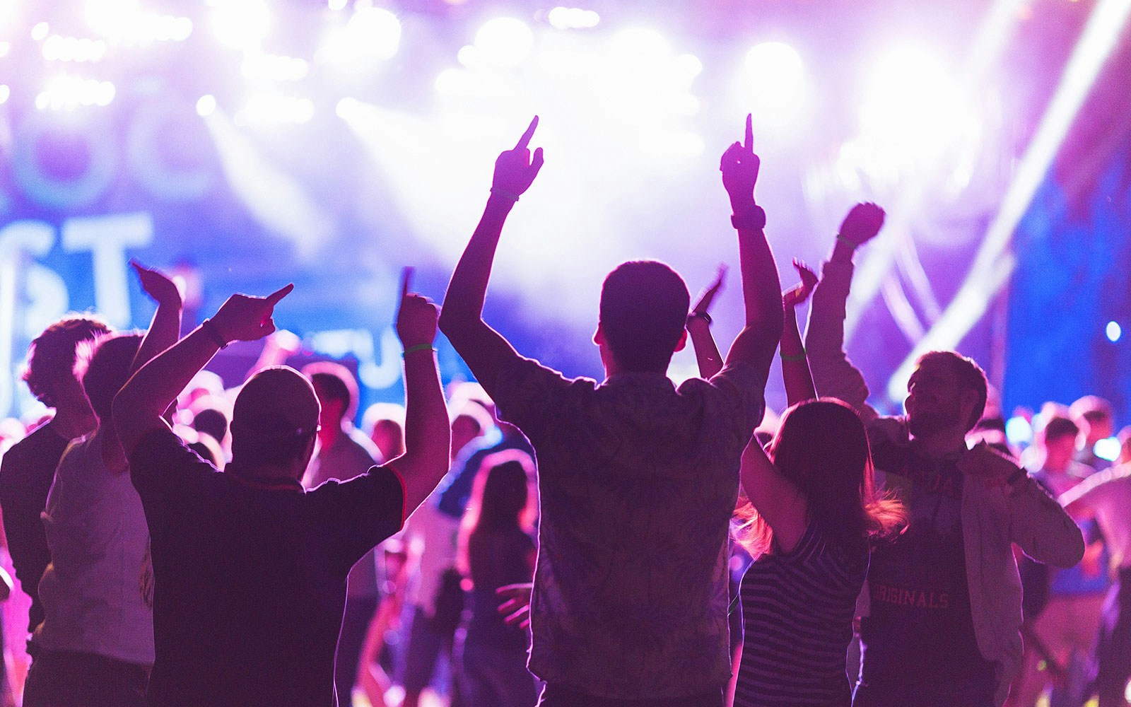 Young people enjoying a vibrant performance at Baloo Ibiza, Spain.