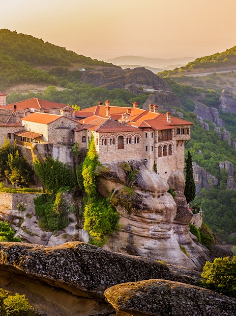 Meteora monastery perched on rock formations in Greece during a guided tour from Athens.