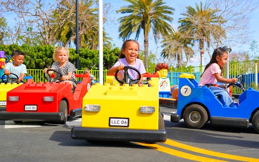 Children driving LEGO cars at Driving School, LEGOLAND® California.