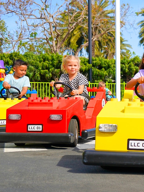 Children driving LEGO cars at Driving School, LEGOLAND® California.