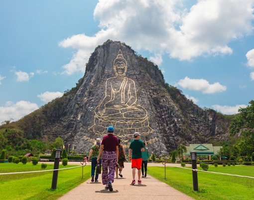 Visiting Khao Chi Chan mountain with its laser cut engraving of Buddha