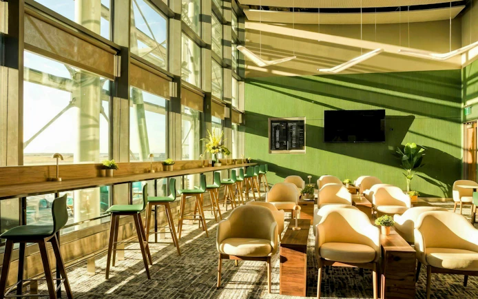 Liffey Lounge seating area with large windows at Dublin Airport.