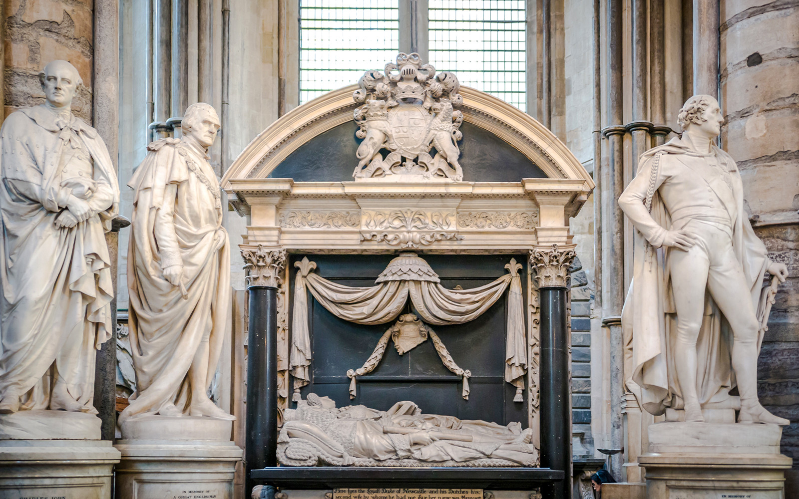 Tomb and statues in Poets' Corner, Westminster Abbey, London.