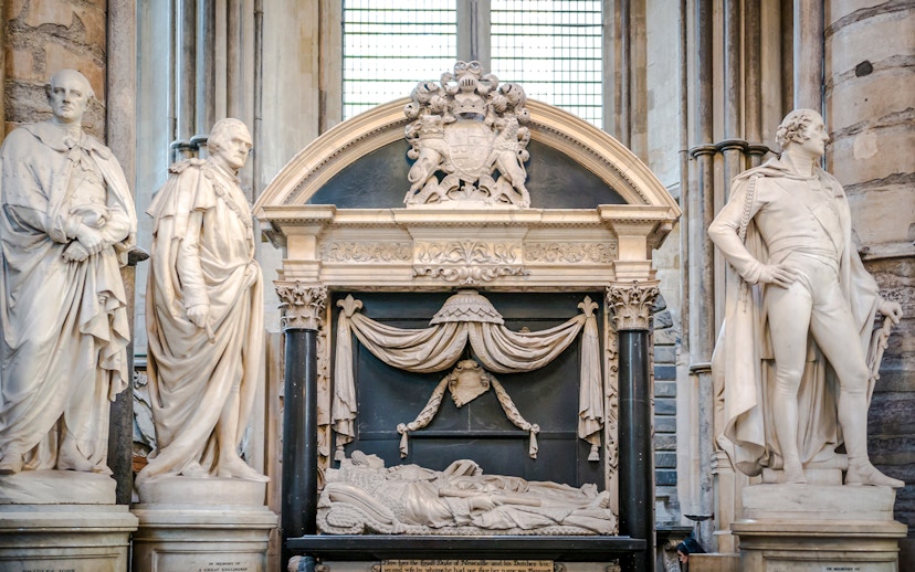 Tomb and statues in Poets' Corner, Westminster Abbey, London.