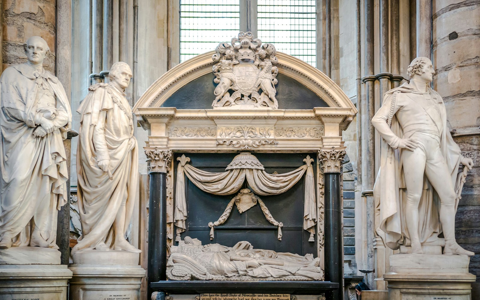 Tomb and statues in Poets' Corner, Westminster Abbey, London.