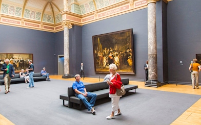 Visitors viewing Rembrandt's "The Night Watch" at the Rijksmuseum, Amsterdam.