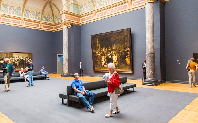 Visitors viewing Rembrandt's "The Night Watch" at the Rijksmuseum, Amsterdam.