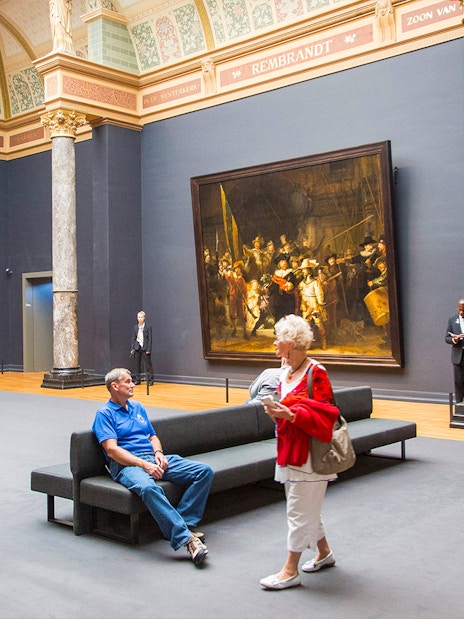 Visitors viewing Rembrandt's "The Night Watch" at the Rijksmuseum, Amsterdam.