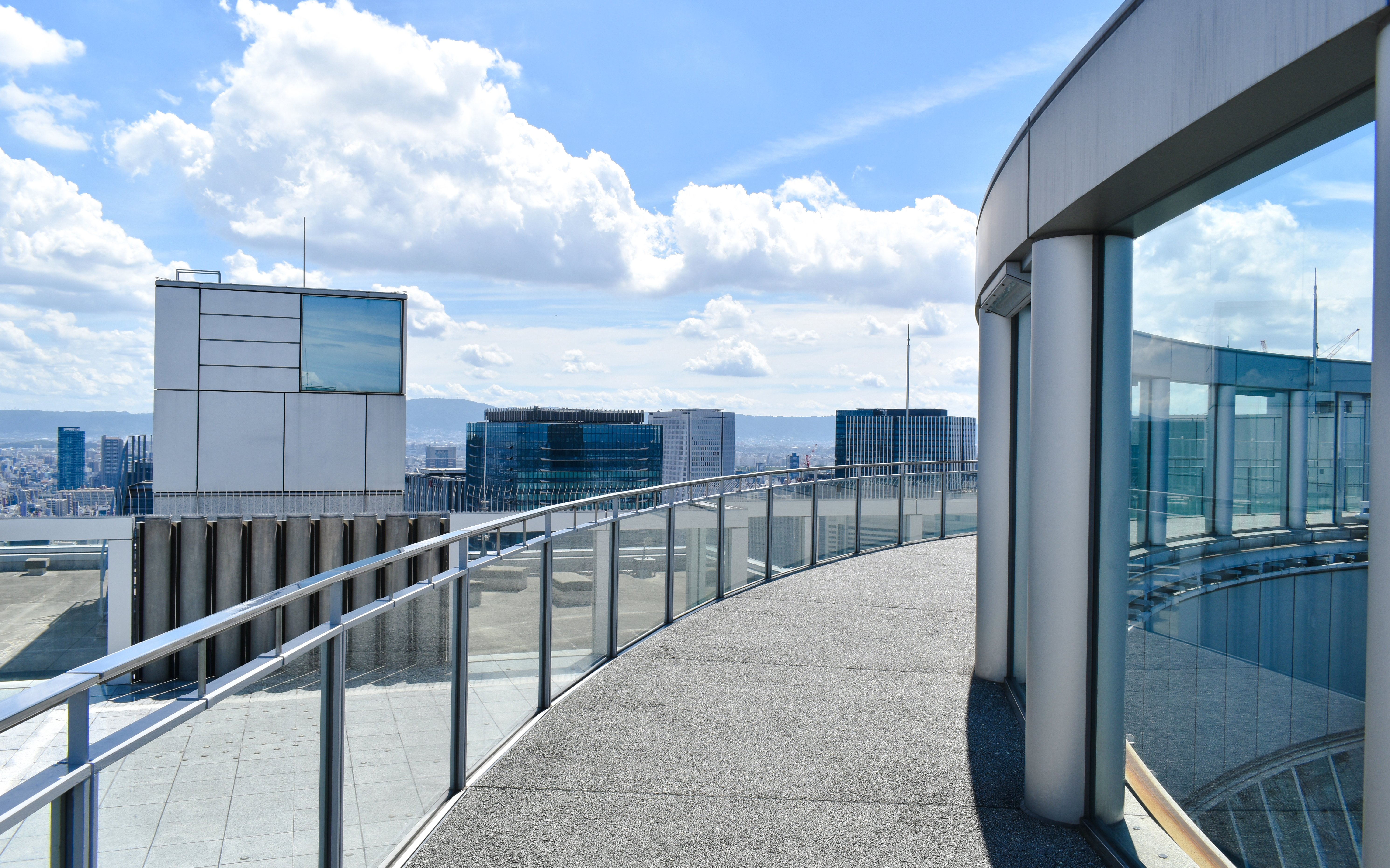 Rooftop view from Umeda Sky Building in Osaka, showcasing city skyline and modern architecture.