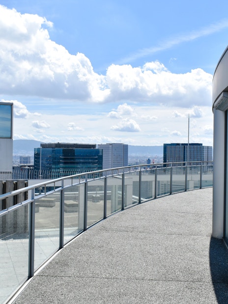 Rooftop view from Umeda Sky Building in Osaka, showcasing city skyline and modern architecture.