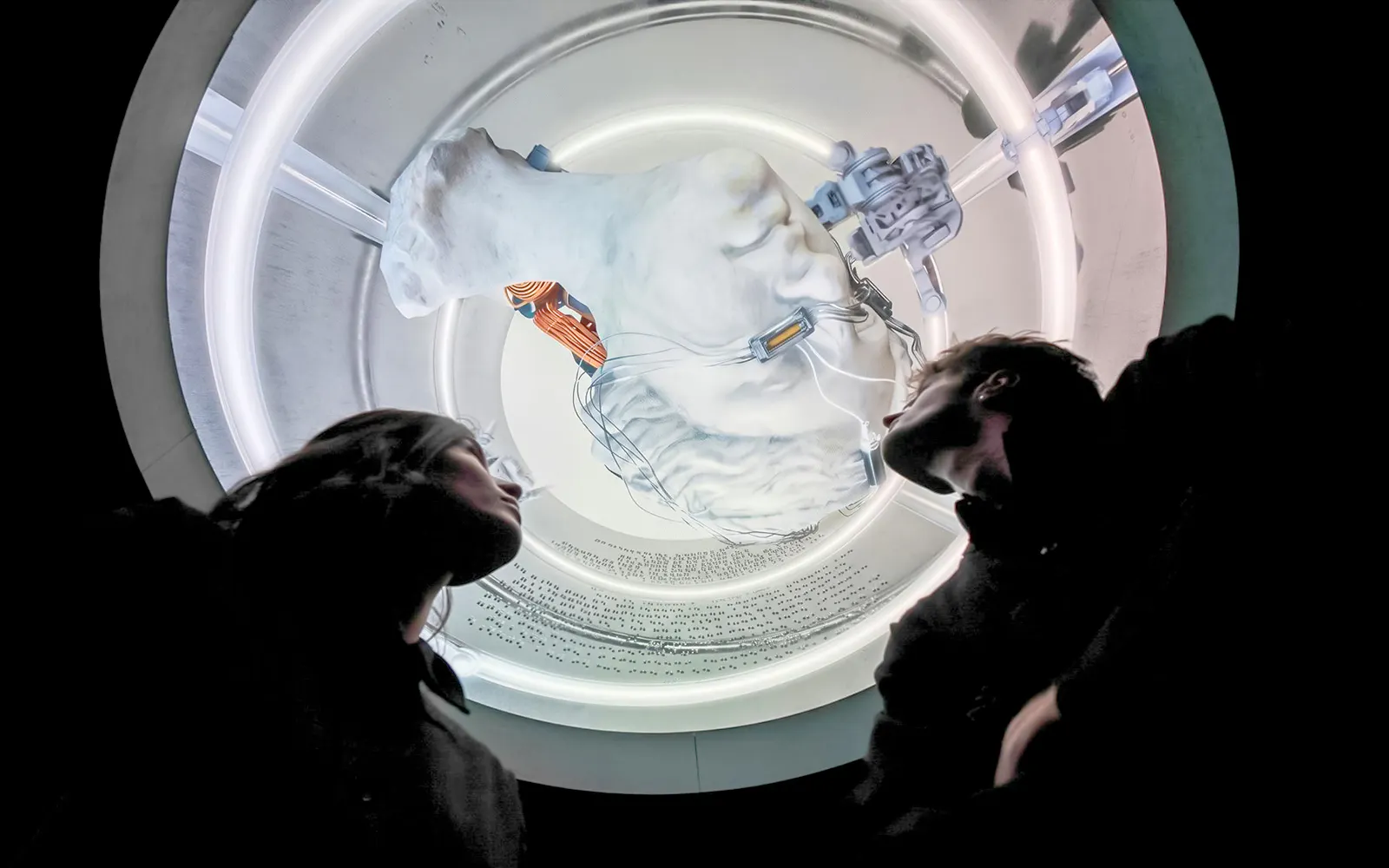 Visitors observing a futuristic art installation at Mercer Labs Museum of Art.