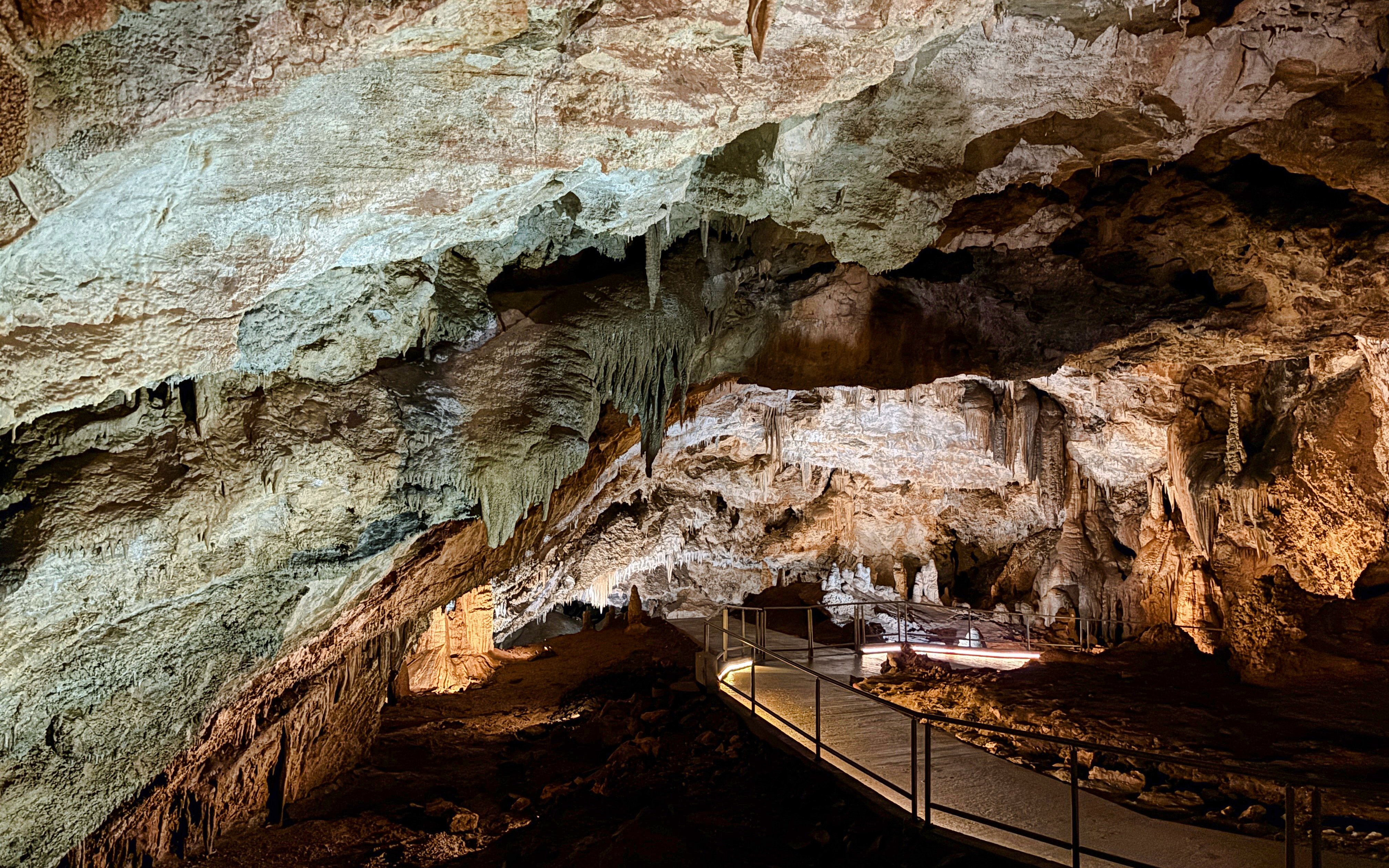 Limestone formations and walkway inside Lipa Cave, Cetinje.