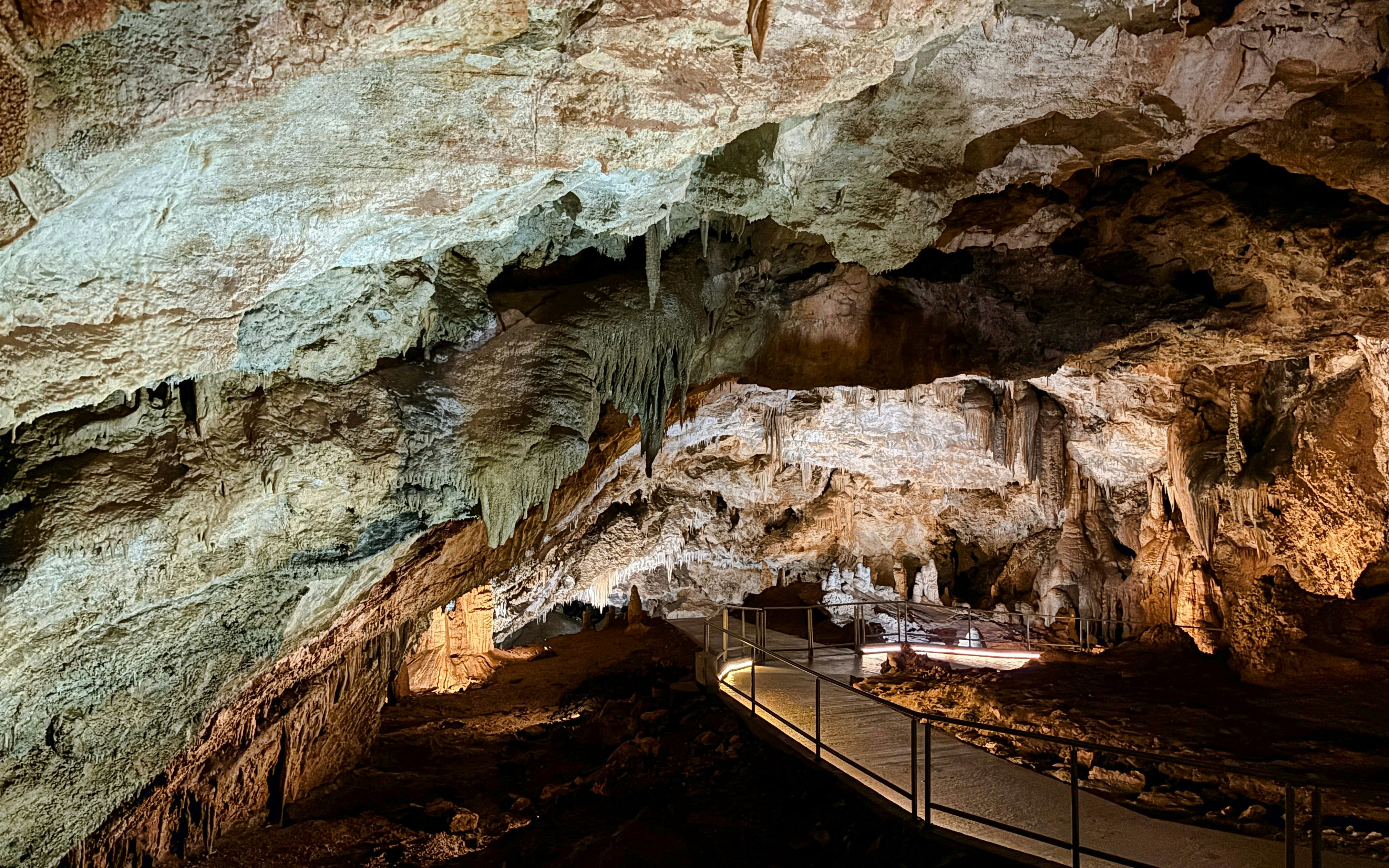 Limestone formations and walkway inside Lipa Cave, Cetinje.