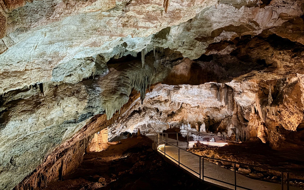 Limestone formations and walkway inside Lipa Cave, Cetinje.